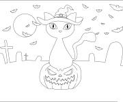 Coloriage Chat sur citrouille dans une cimeti&egrave;re &agrave; motifs facile