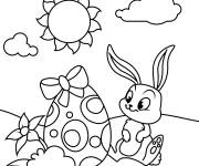 Coloriage B&eacute;b&eacute; lapin assis pr&eacute;s d'un oeuf de P&acirc;ques