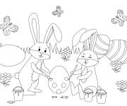 Coloriage Deux lapins qui paigne les oeufs de P&acirc;ques