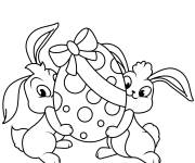 Coloriage Deux petits lapins levant un oeuf de Paques