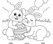 Coloriage Famille de lapins avec des oeufs de p&acirc;ques