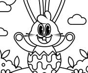 Coloriage et dessins gratuit Joyeux lapin assis dans un &oelig;uf de P&acirc;ques en ligne à imprimer