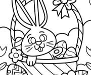 Coloriage et dessins gratuit Lapin assis dans un panier de P&acirc;ques pour petits à imprimer