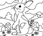 Coloriage et dessins gratuit Lapin de P&acirc;ques debout dans un champ à imprimer