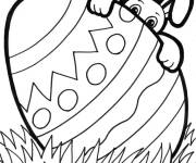 Coloriage Lapin de P&acirc;ques derri&egrave;re un oeuf d&eacute;cor&eacute;