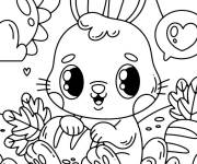 Coloriage lapin de p&acirc;ques kawaii  avec une carotte dans la main