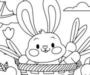 Coloriage lapin de p&acirc;ques mignon dans un panier en maternelle