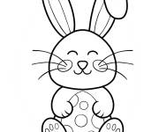 Coloriage Lapin de P&acirc;ques souriant embrassant un &oelig;uf &agrave; pois