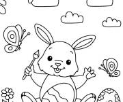 Coloriage et dessins gratuit Lapin de P&acirc;ques tenant un pinceau stylis&eacute; à imprimer