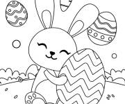 Coloriage Lapin embrassant des oeufs de P&acirc;ques &agrave; impri