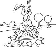 Coloriage Lapin mignon et panier garni d'oeufs de P&acirc;ques