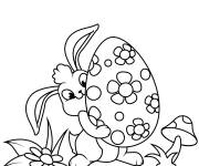 Coloriage Lapin soul&egrave;ve un oeuf de Paque