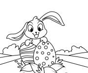 Coloriage Lapin tenant deux oeufs de P&acirc;ques