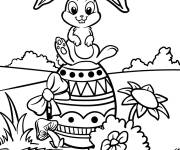 Coloriage Petit Lapin de P&acirc;ques sur une oeuf bien paign&eacute;