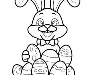 Coloriage Un mignon lapin de P&acirc;ques entour&eacute; d'&oelig;ufs CE1