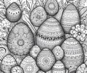 Coloriage Des oeufs de P&acirc;ques d&eacute;cor&eacute;s dans le pr&eacute;s