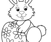 Coloriage et dessins gratuit Lapin mignon tenant un oeuf de Pâques facile à imprimer
