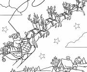 Coloriage Le tra&icirc;neau du P&egrave;re No&euml;l survole le village avec ses rennes