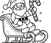 Coloriage P&egrave;re noel  sur son traineau avec des bonbons