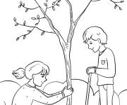 Coloriage Enfant s'amusant sous l'arbre
