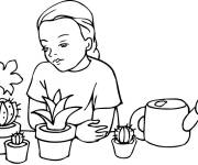 Coloriage Petite fille devant des cactus en pot