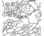 Coloriage Gar&ccedil;on s'amuse avec la papillon