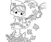 Coloriage Gar&ccedil;on mignon d&eacute;core les feuilles d'automne