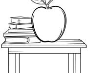 Coloriage Une grosse pomme pr&ecirc;t des livres sur la table