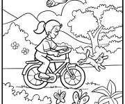 Coloriage Fille sur un v&eacute;lo au beau temps du Printemps