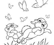 Coloriage Les lapins attrapent des papillons au printemps