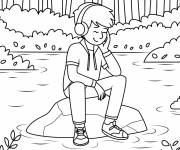 Coloriage Ado de 15 ans &eacute;coute de la musique sur un rocher