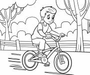 Coloriage Ado p&eacute;dale dans le parc