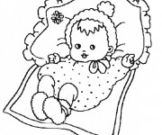 Coloriage Bébé fille sur le lit
