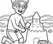 Coloriage Blippi sur la plage construit un ch&acirc;teau en sable