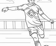 Coloriage Footballeur tire le ballon