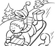 Coloriage Gar&ccedil;on s'amuse sur la luge pendant la saison d'hiver