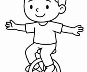 Coloriage Enfant s'&eacute;quilibre sur le monocycle
